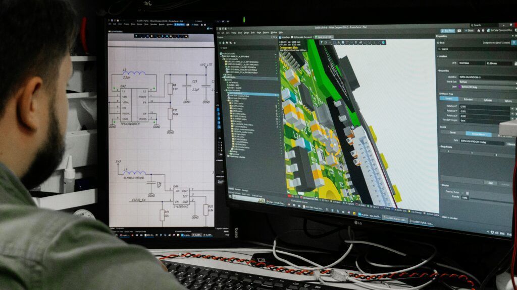 Mechanical design engineer working on CAD drawings for industrial packaging machinery